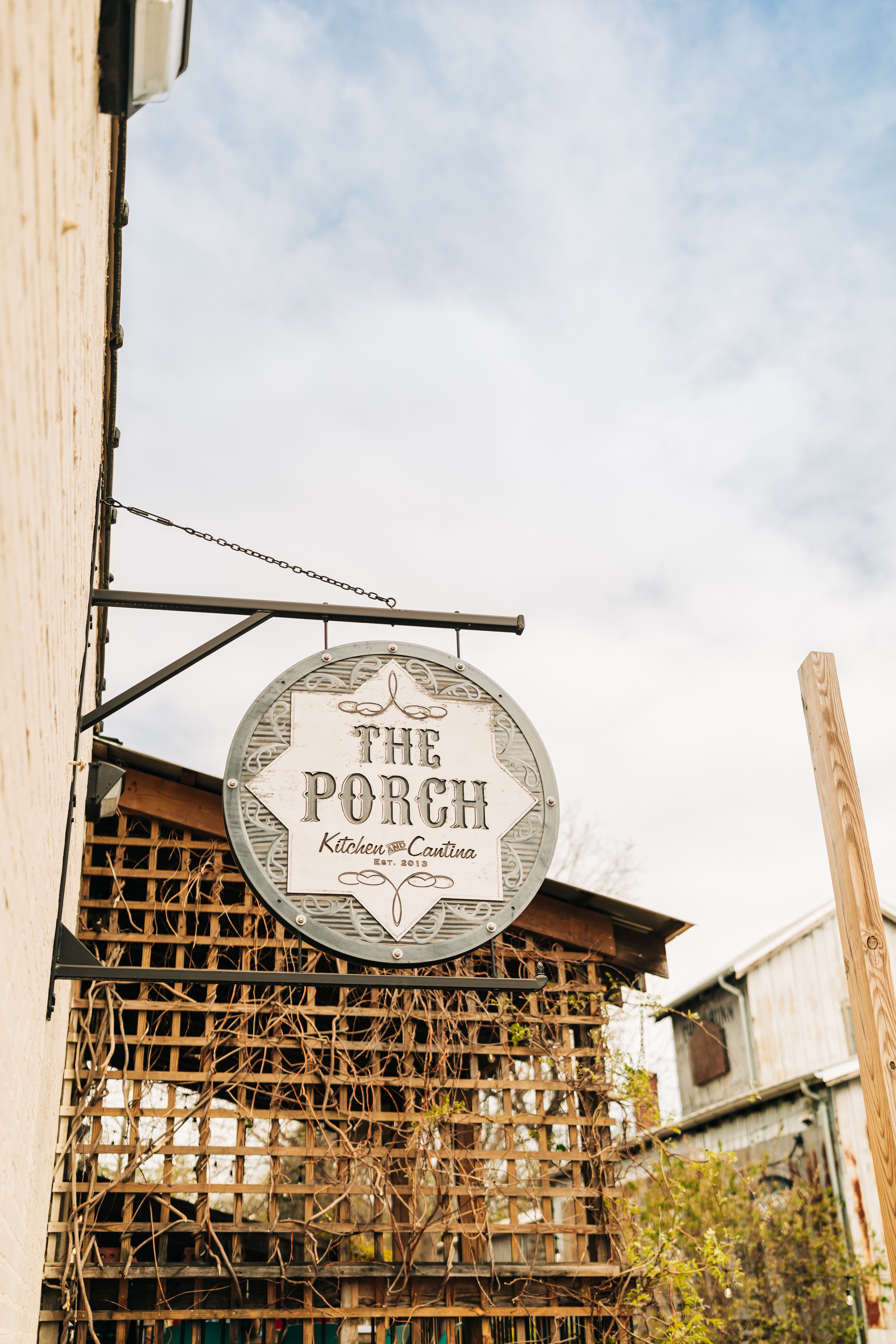 The Porch Kitchen & Cantina sign exterior in Winston-Salem, part of Yallsome Restaurant Group.